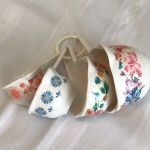 Floral measuring cups different floral design each cup preowned excellent cond.